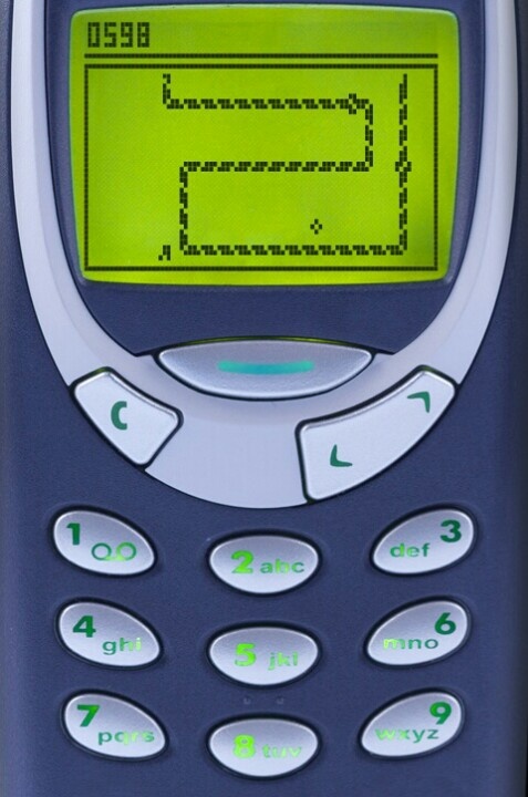 old Nokia phone with snake game playing